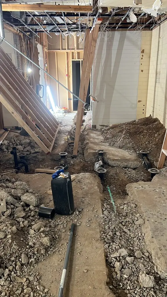 Excavation and underground drainage work during renovation